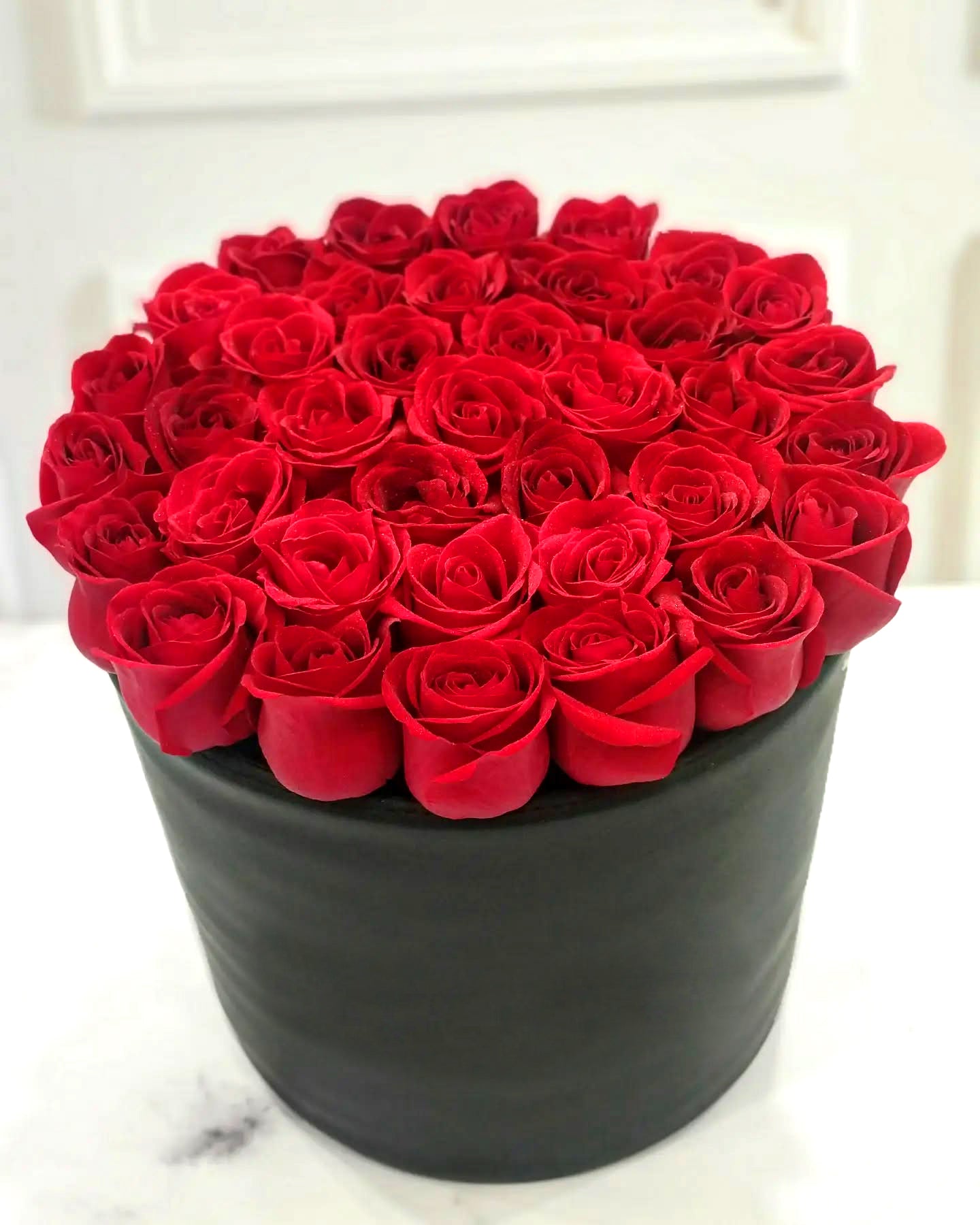 Red Roses in a Round Box